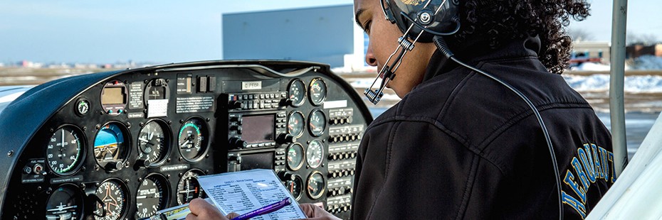 Student completes preflight check in plane's cockpit