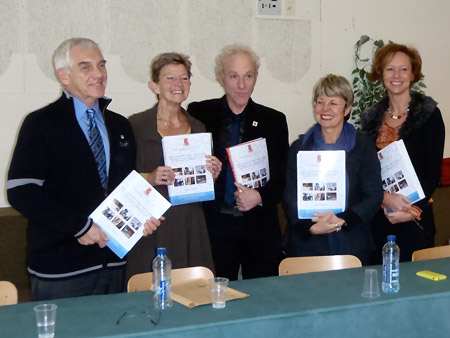 Alan Wright (left) and former Visiting Fellow Marianne Poumay (right) hold copies of Dr. George’s thesis after announcing a successful defense at the Université de Liège, Belgium.