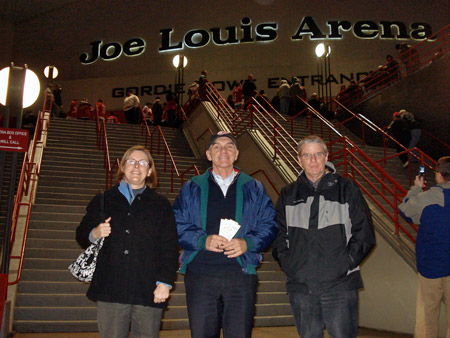 Alan Wright along with Gordon and Julie Joughin pose outside the Joe Louis Arena.