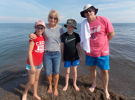 The Paterson family standing at the most southern tip of Canada.