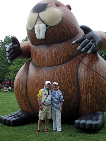 Patsy and Alan Paxton stand in front of a 25 foot high inflatable beaver.