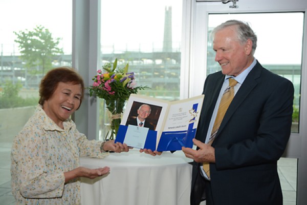 Bernarda Camello-Doctor receives the Governor General’s Caring Canadian Award from provost Bob Orr