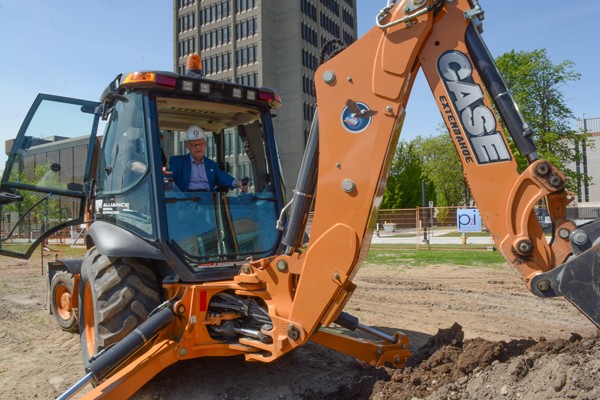 Dave Wilson operating backhoe