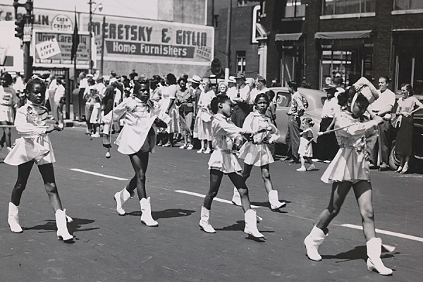 Majorettes spinning batons in parade