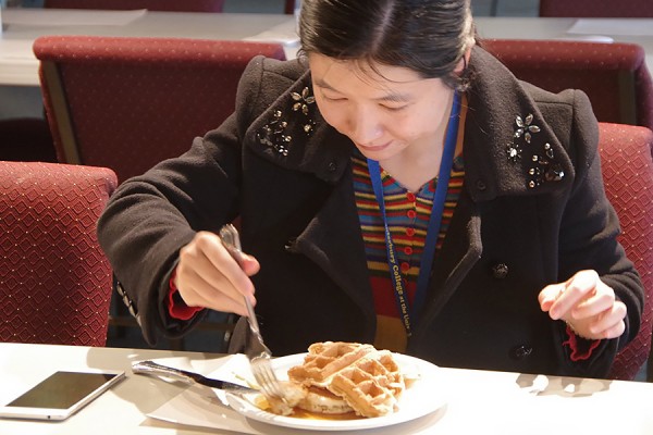 Nan Yang digs in to a plateful of waffles and pancakes