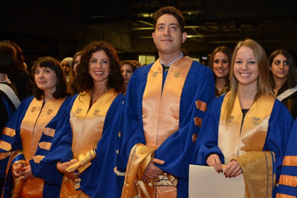 Grads posing in gowns