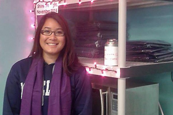 Tracy Huynh sports a purple scarf to symbolize the fight against domestic violence.