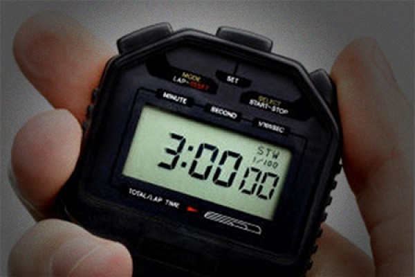 hand holding stopwatch set to 3 minutes