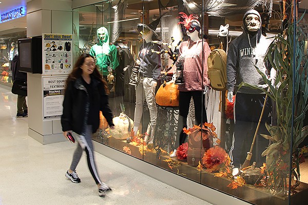 Masks and costumes on display outside the Campus Bookstore