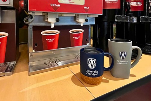 re-usable mugs at coffee dispenser