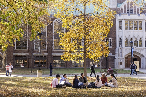 students seated on lawn outside Dillon Hall