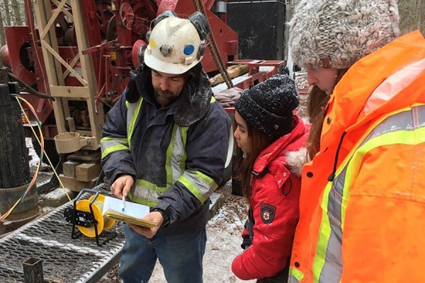 Driller Johnny H. Wilson, students Jezel Gicole and Sandra Reaume.