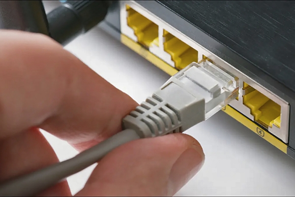 hand pulling ethernet connection