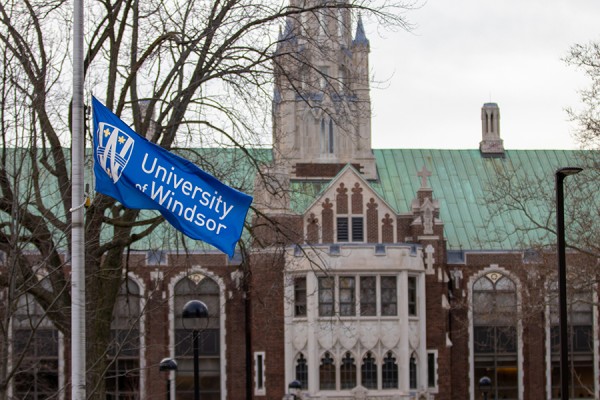 University of Windsor flag lowered outside Dillon Hall
