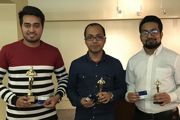 Tahir Chowdhry, Soham Mitra, and Gopal Kotwal hold awards statuettes