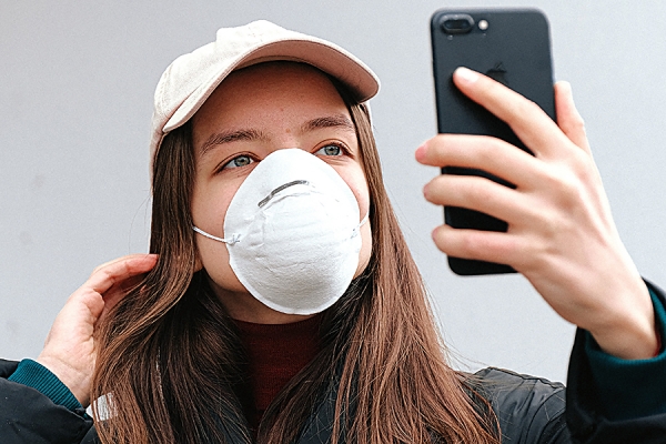 young woman taking selfie