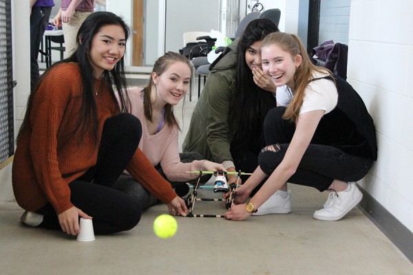 Mylene Tu, Jessica Doe, Aditi Kukreja and Franci Toth test their catapult