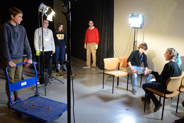 Students light and stage a scene from “Harry Potter and the Philosopher’s Stone” under the watch of technicians and faculty during Take Our Kids to Work Day.