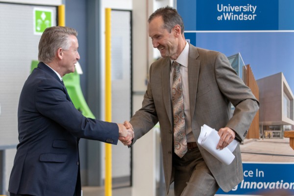 UWindsor interim president Douglas Kneale extends thanks to Windsor Mold CEO Keith Henry for a donation to the University’s fundraising campaign.