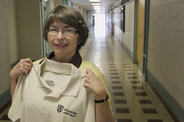 Elizabeth McDermott holding polo shirt