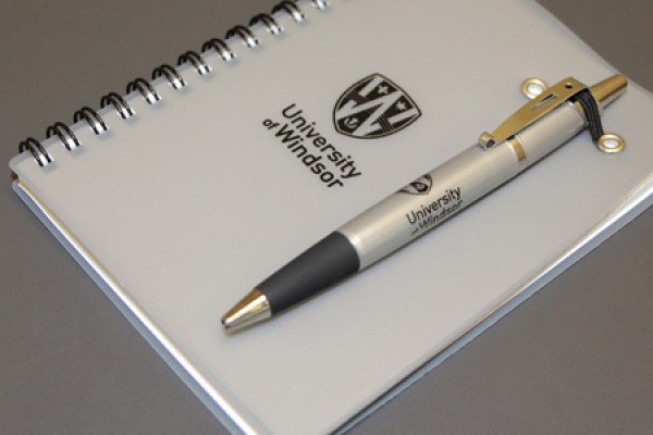 spiral-bound notebook and matching pen