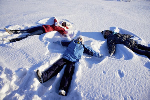 Students making snow angels.