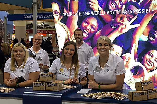 Recruitment officers Dierdre Charron, Chris O’Gorman, Savanna Bertotti, Cory Simard and Abigail Pyke greet prospective students at the UWindsor booth.