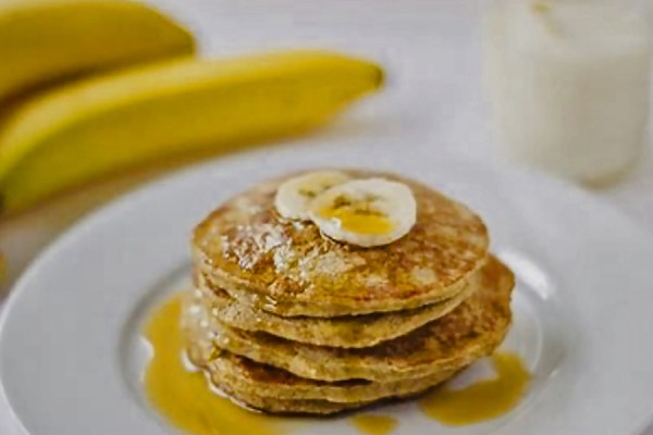 Pancakes topped with sliced banana