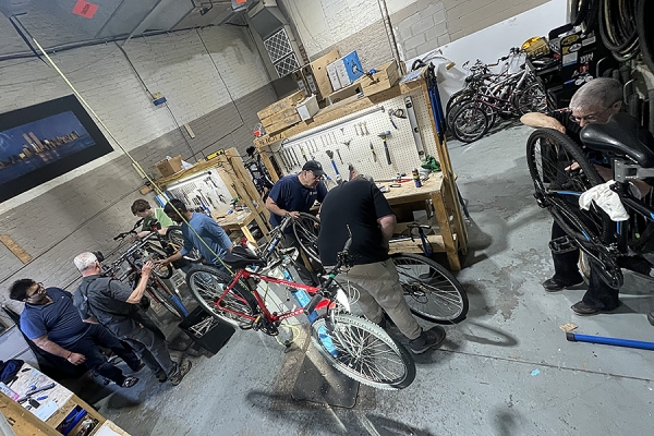 Volunteers at the Bike Kitchen ready bicycles for the Graduate Student Society annual bike sale Wednesday in the CAW Student Centre.