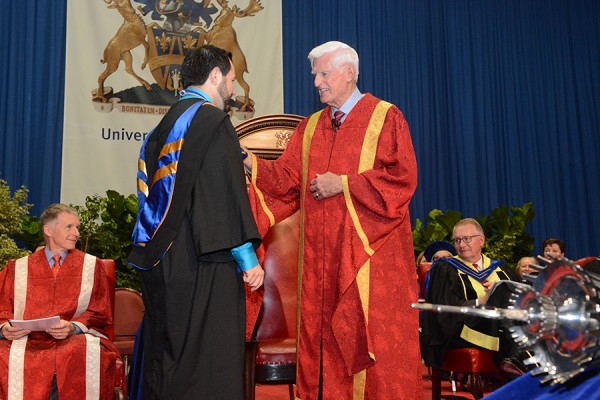 Chancellor greeting graduand during Convocation ceremony