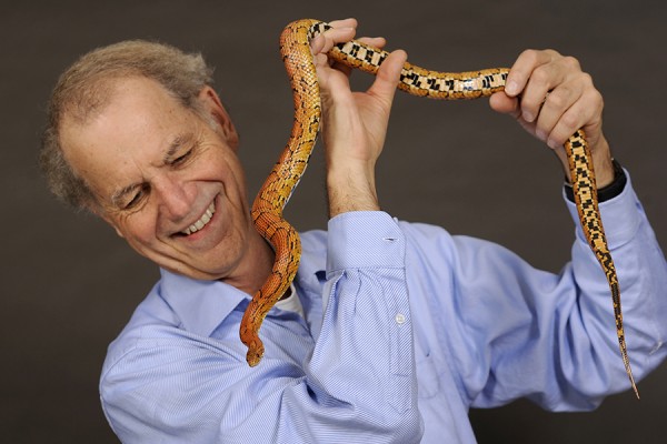 Hal Herzog holding large snake