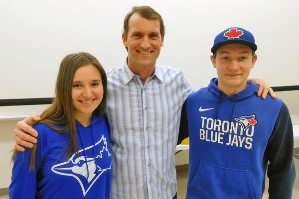 Michaela Ammendolia and Anthony Fehr flank alum Joe Siddall 