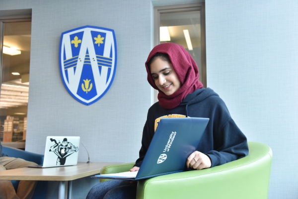 student working at laptop computer