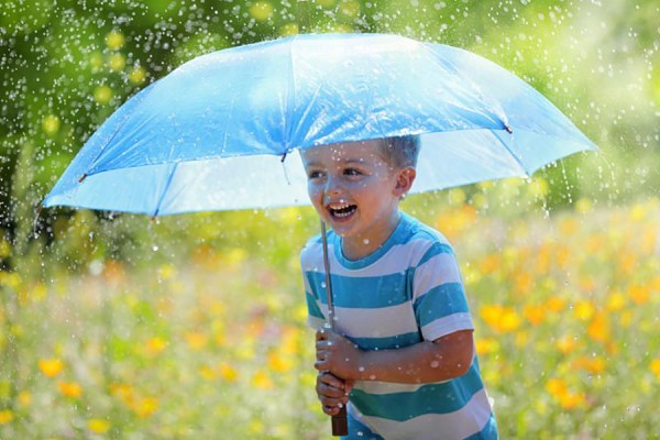 boy holding umbrella