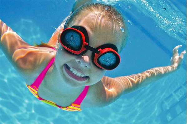 kid swimming in pool