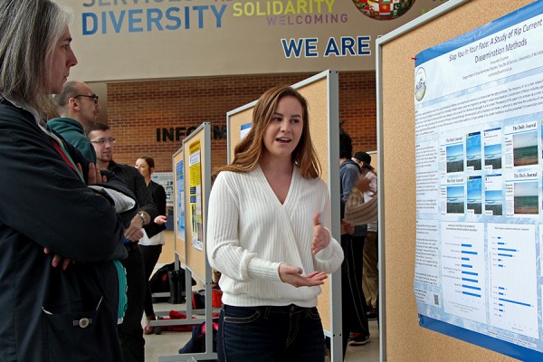 Alexandra Scaman describes her research poster