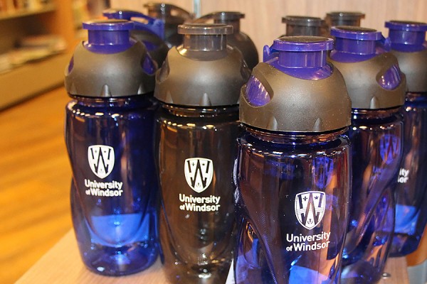 Blue and black water bottles are on sale at the Campus Bookstore.