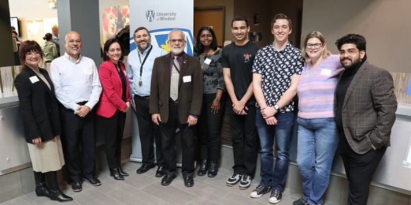 Computer science students and faculty join officials from the University of Windsor and Sterling Information Technologies