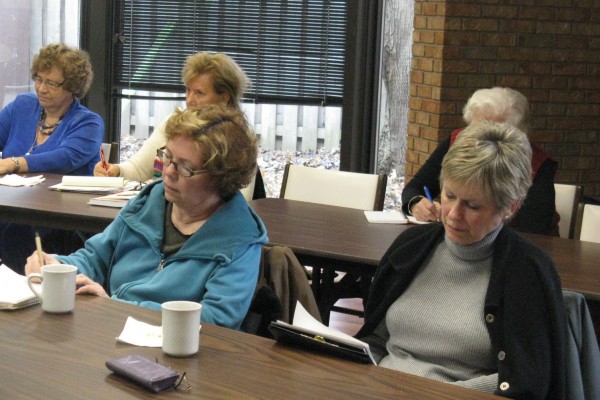 UNI-COM members writing their memoirs.