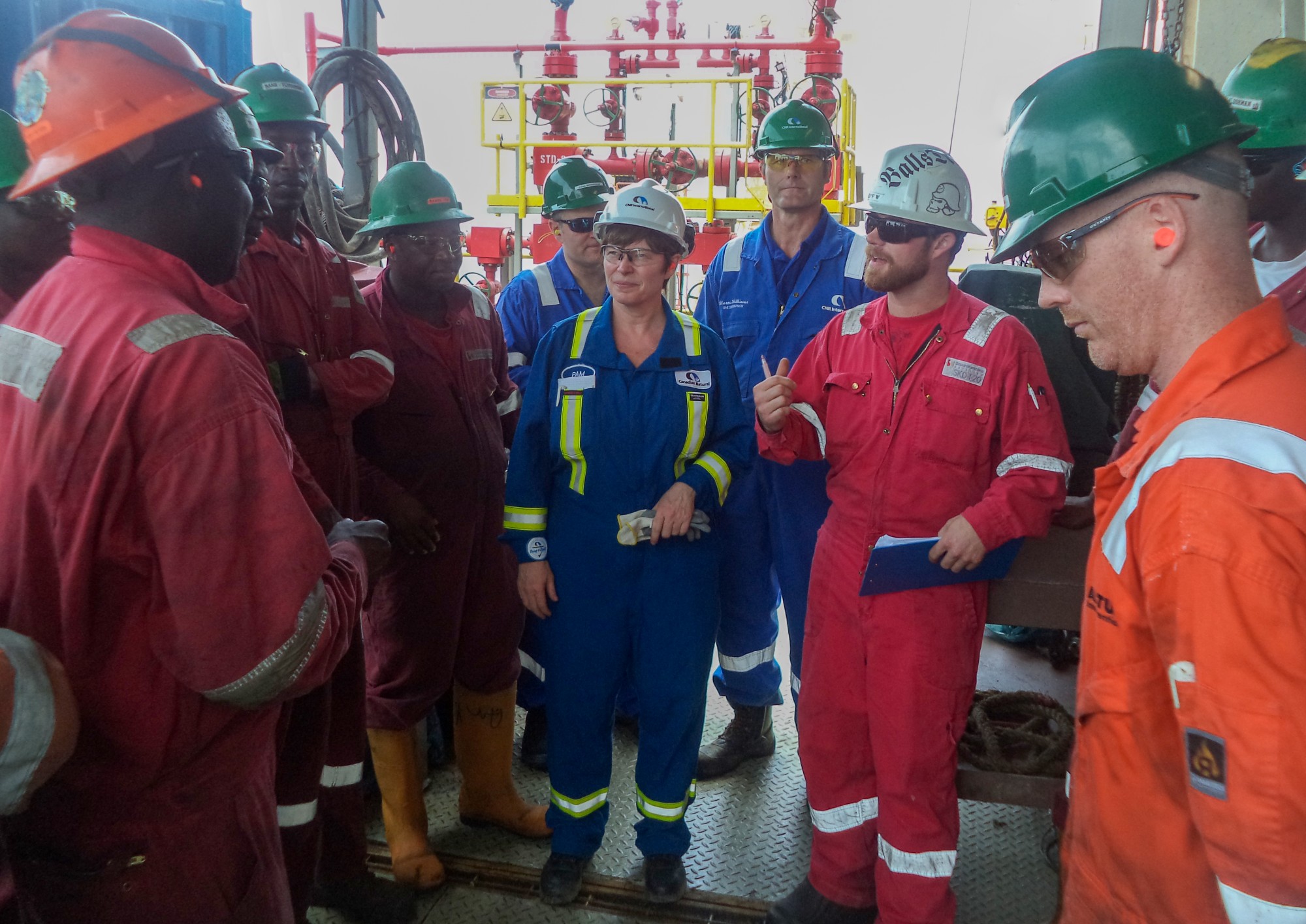 Pamela Nadin-McIntyre with a drilling team during a visit to Canadian Natural Resources Limited’s