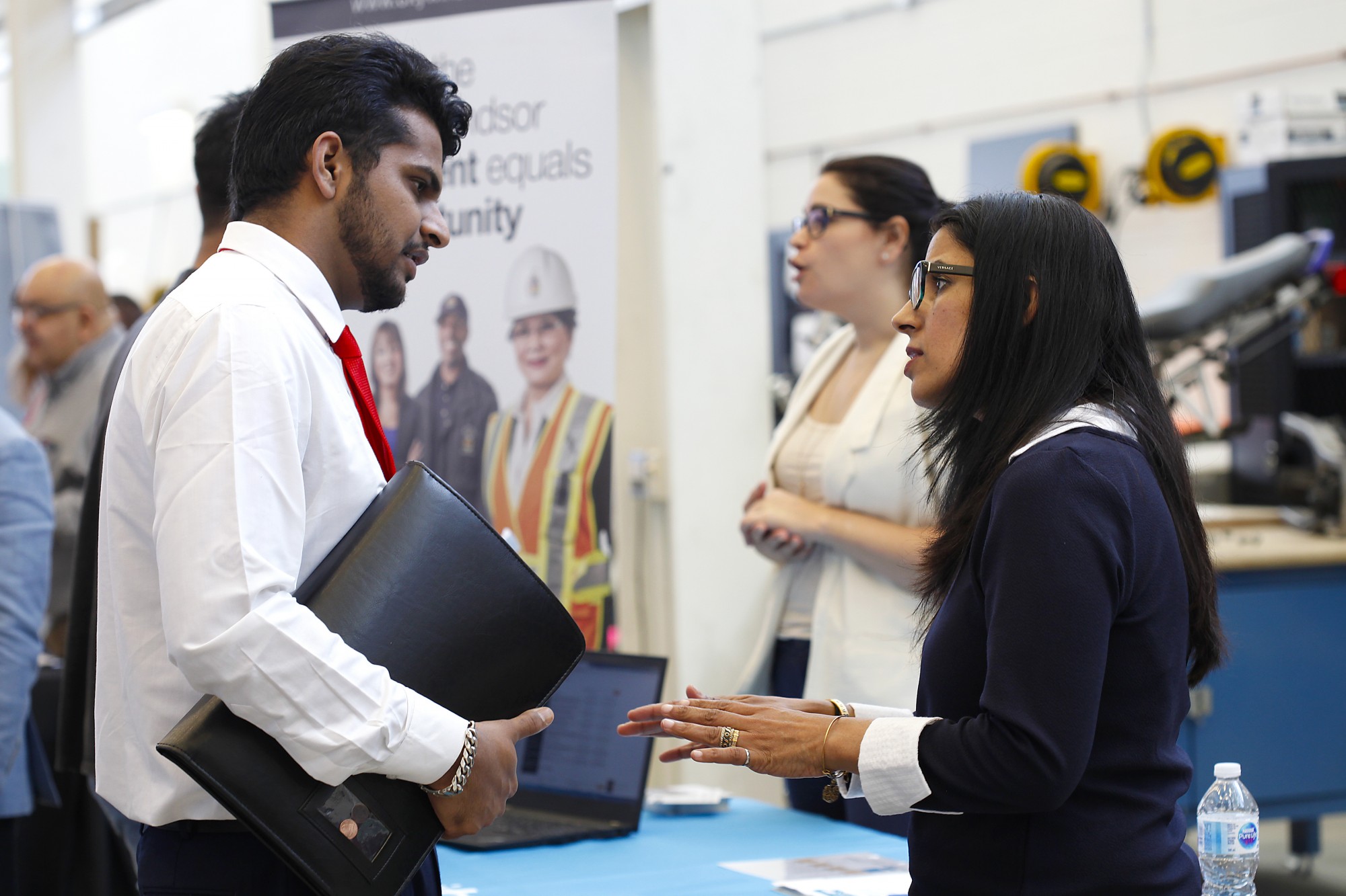 Engineering student talking with local employer