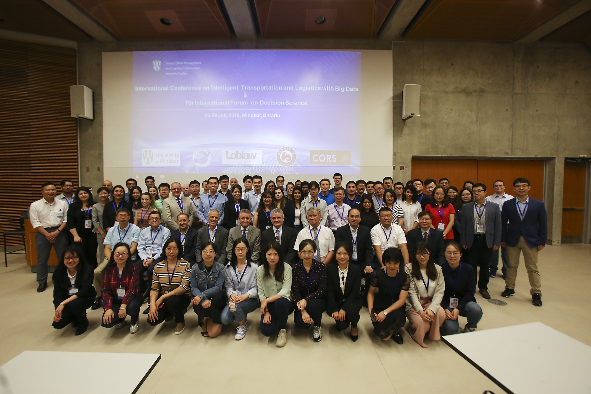 international researchers taking a group picture after the event