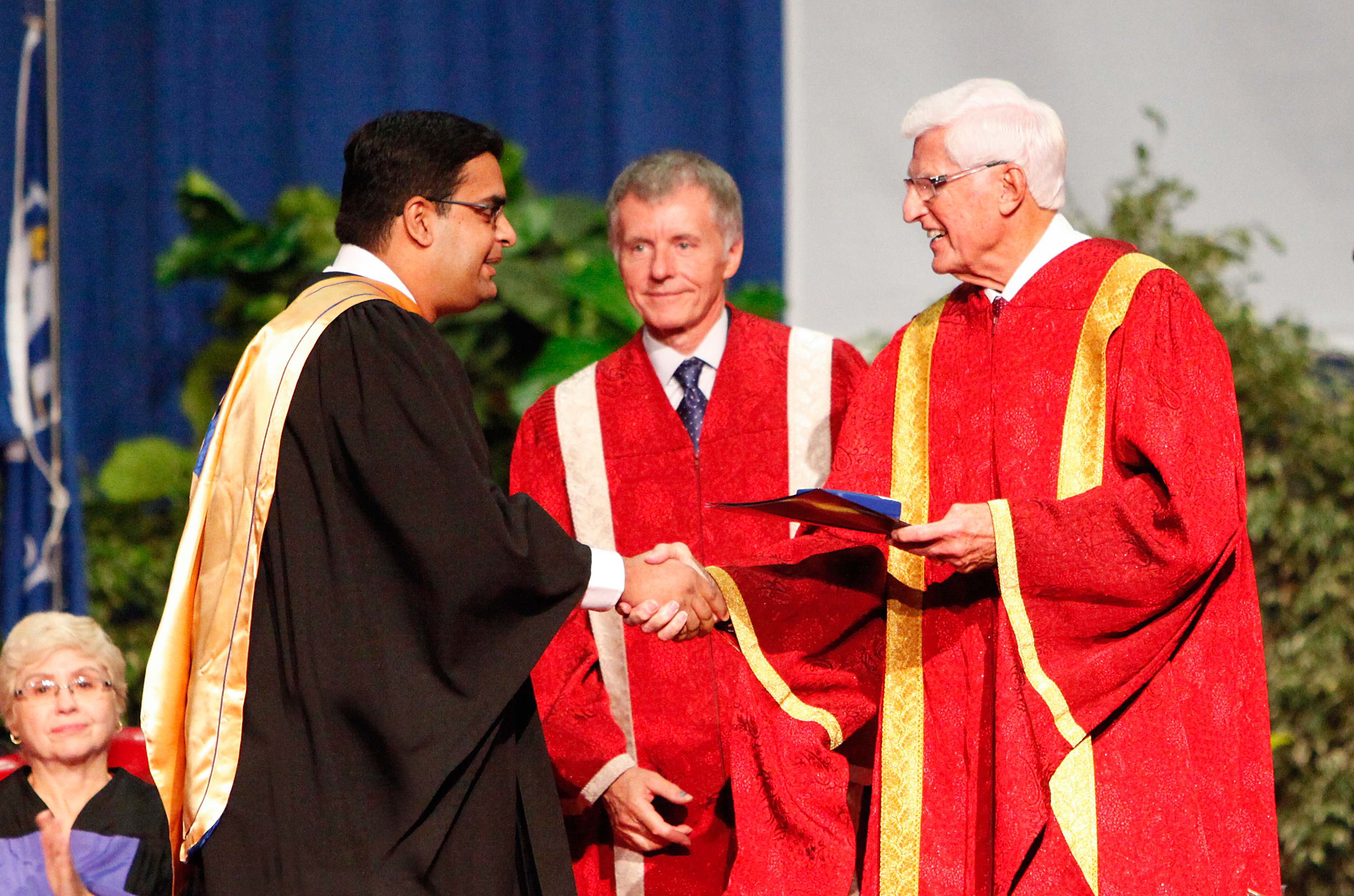 Lakshmi Varaha Iyer, a recipient of the Governor General’s Gold Medal, receives congratulations from UWindsor president Alan Wildeman and chancellor Ed Lumley, Saturday at Convocation.