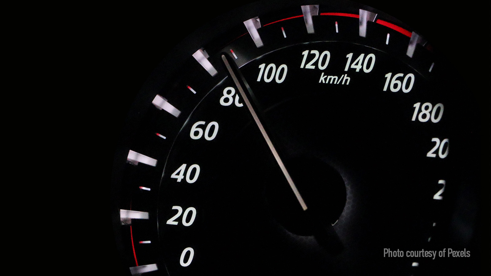 Closeup of car speedometer. Photo courtesy of Pexels.