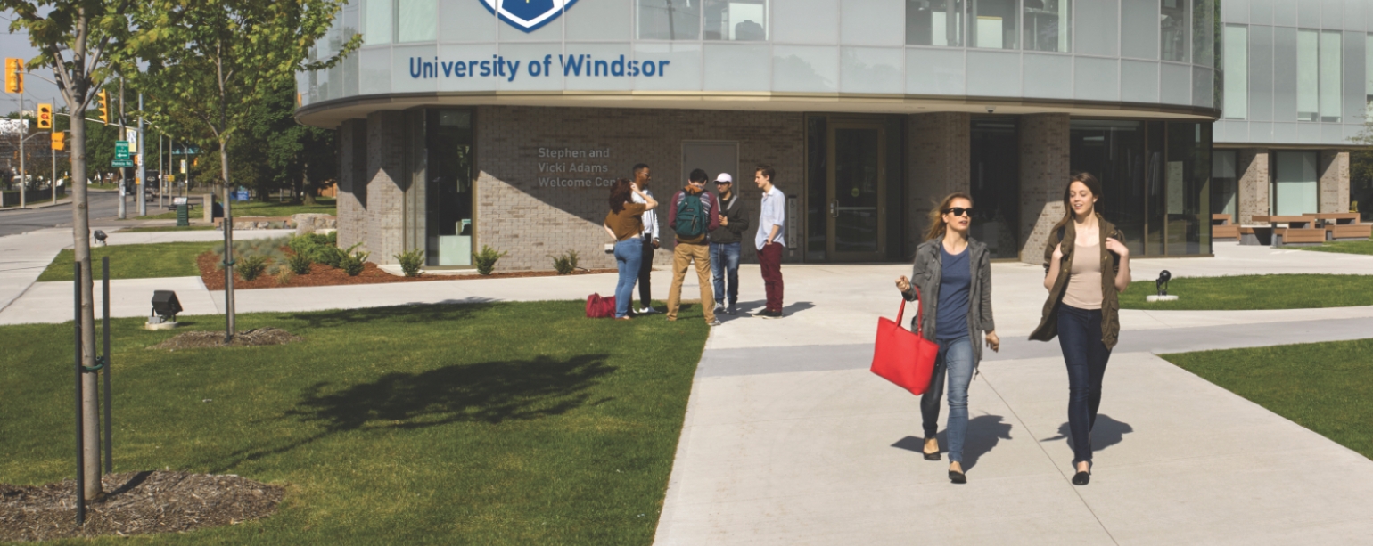 Students walking in front of the Welcome Centre
