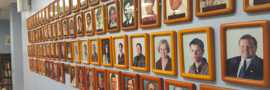 Photos of Faculty on a wall