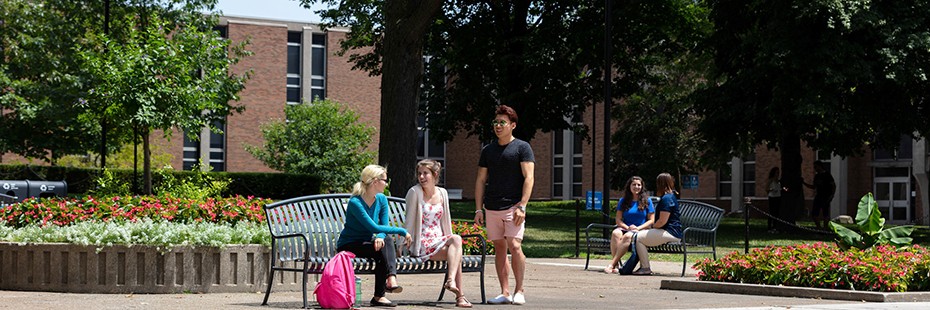 Students enjoy the flowers on the UWindsor quad