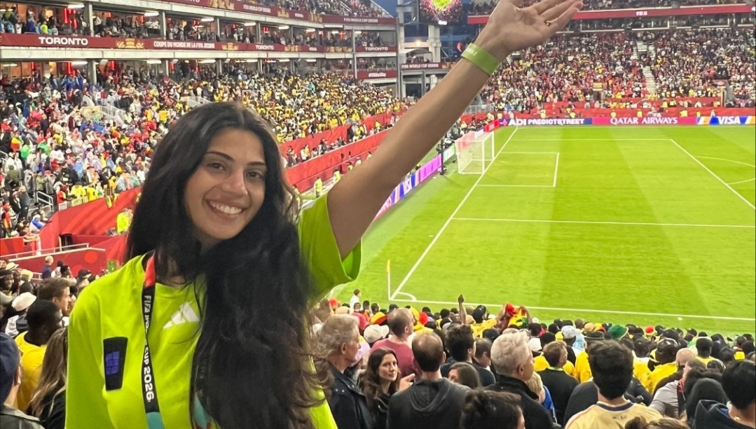 Casandra Asoufi with her arm raised in the World Cup stadium in Toronto