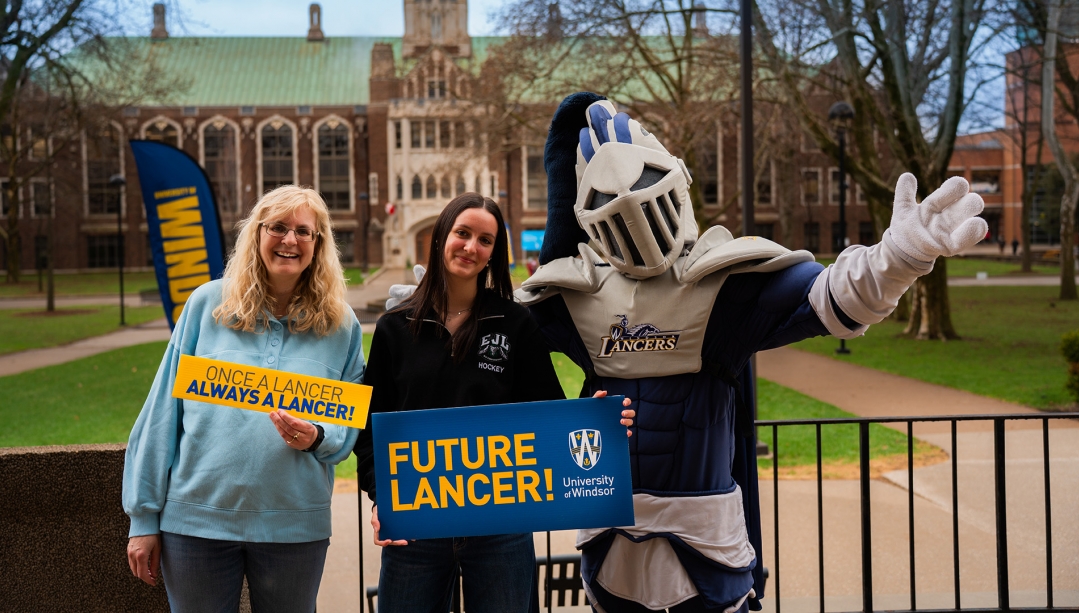A future lancer celebrates with a family member and Winston.