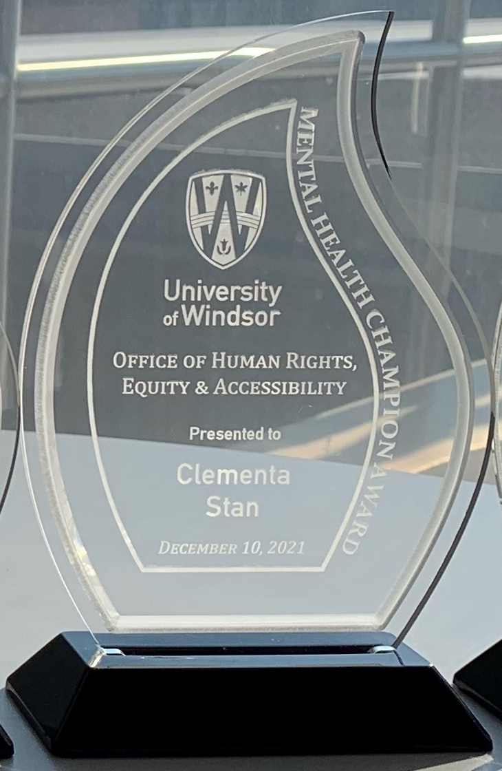 clear acrylic trophy presented to Clementa Stan, Mental Health Champion Award